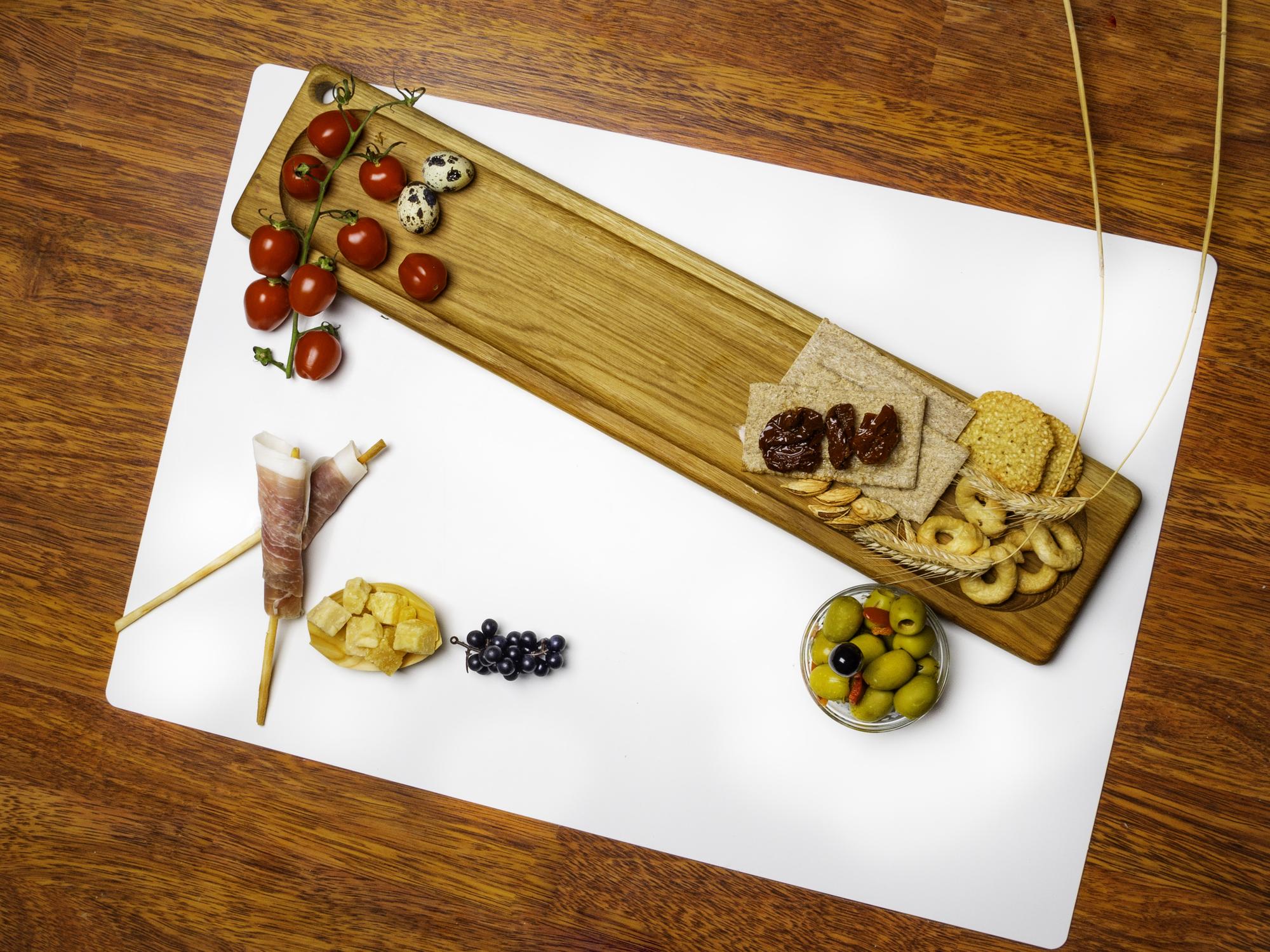 Long wooden table with plated tasting courses