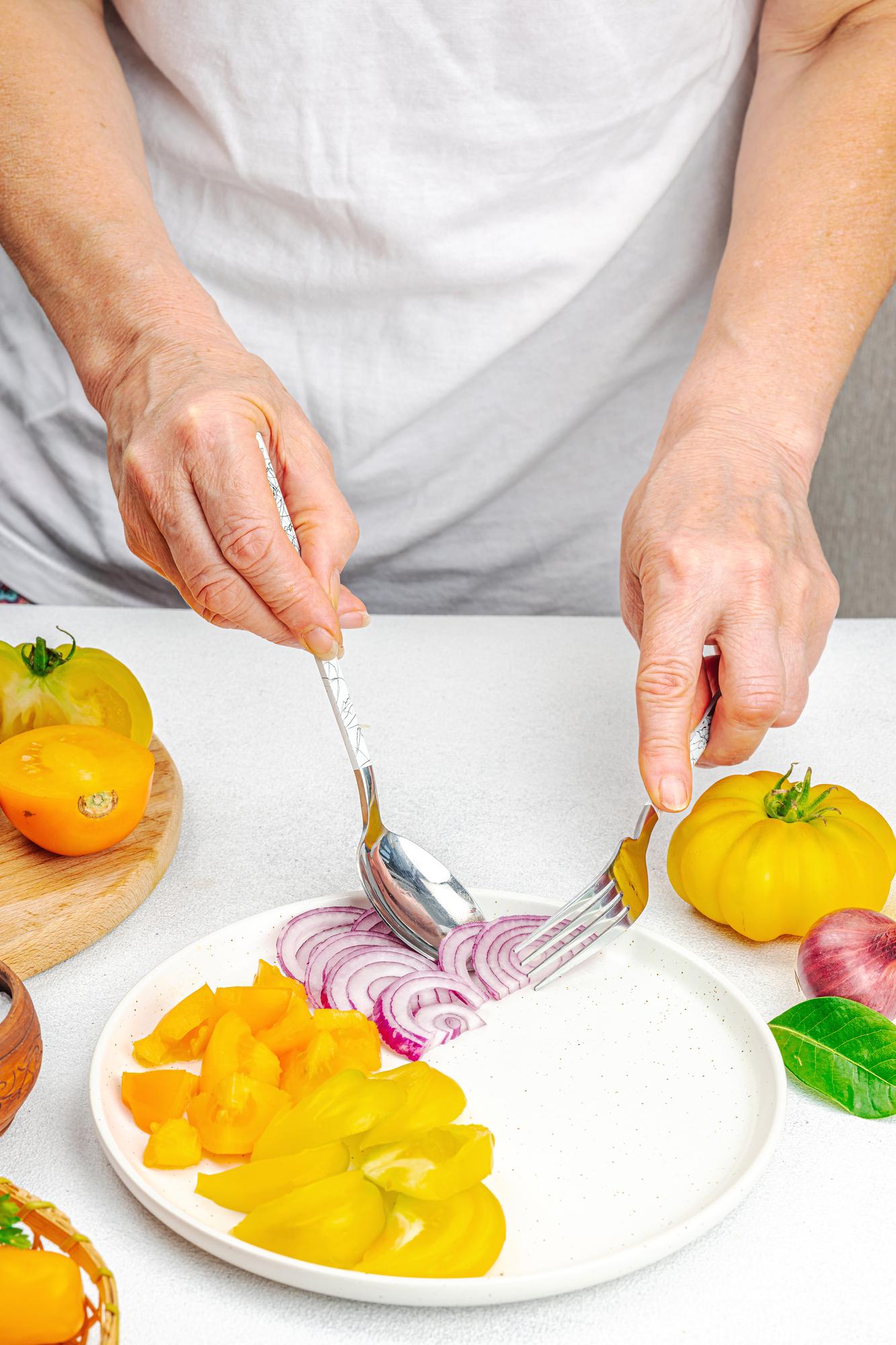 Chef plating a colorful local dish
